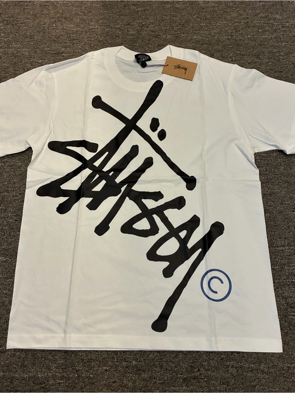 Stussy White Short-Sleeve Tee with Oversized Black Script Logo